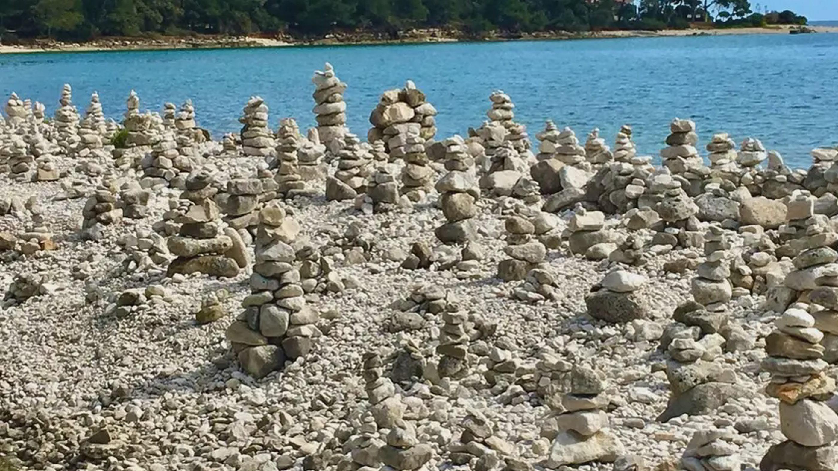 Smooth stone beach in Zlatni Rt park